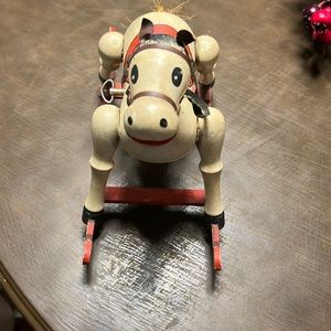 Wind up 1979 enesco toy horse musical. Crack on bottom brace in picture